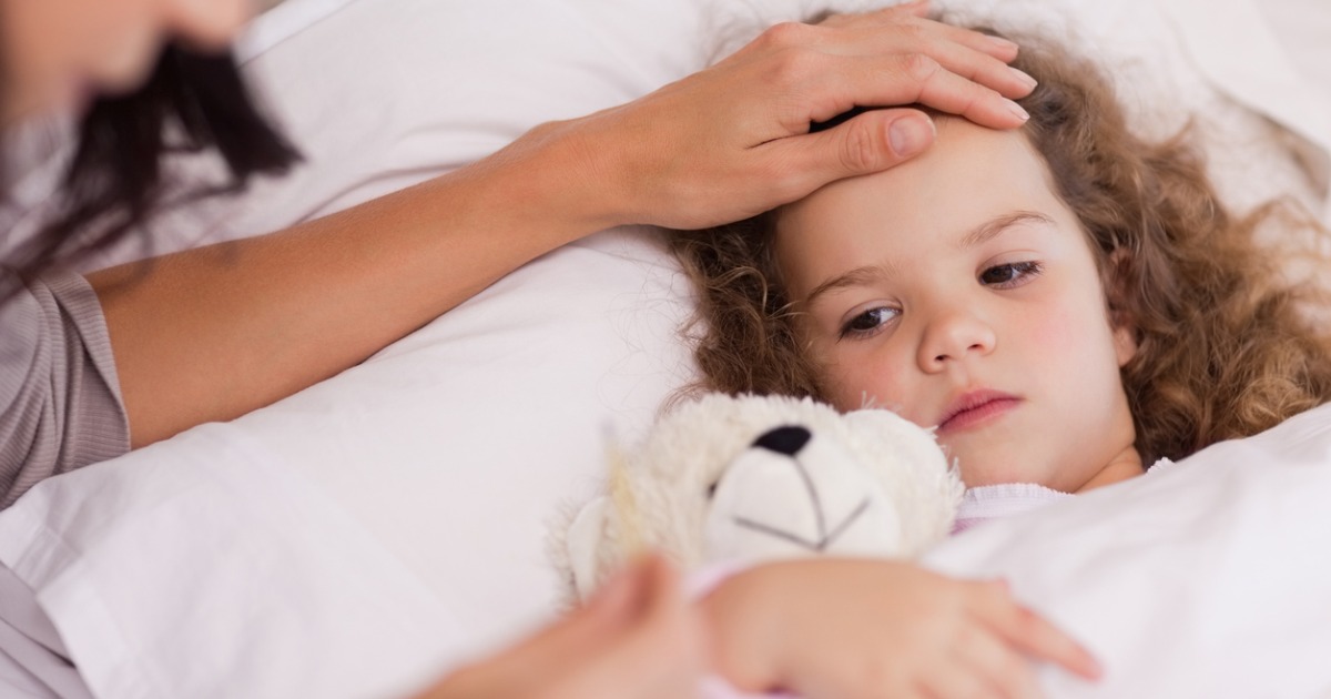 Mother taking care of her sick daughter