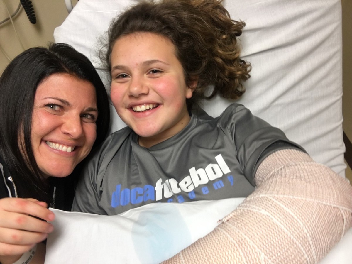 Arianna and Mom, right after wrist surgery at Connecticut Children’s