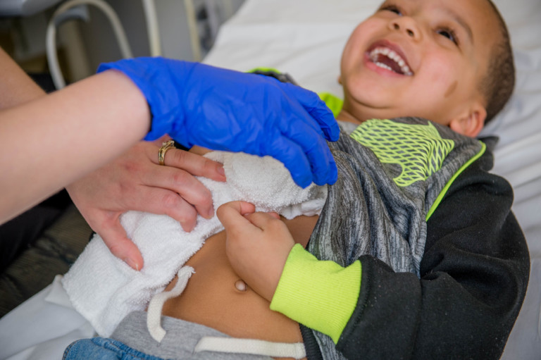 patient laughing as he gets ultrasound