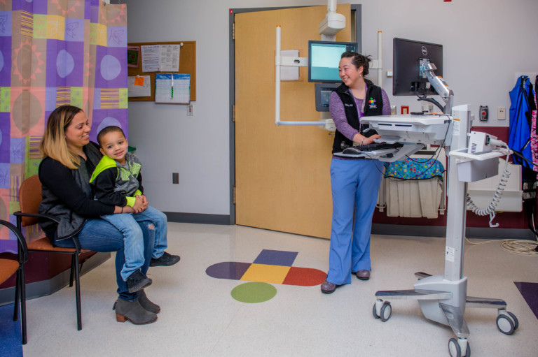 nurse with patient in room