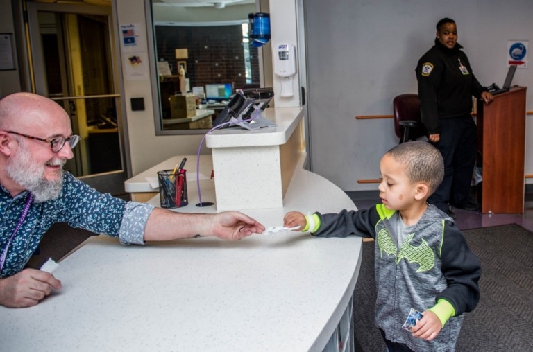 patient checking in at welcome desk