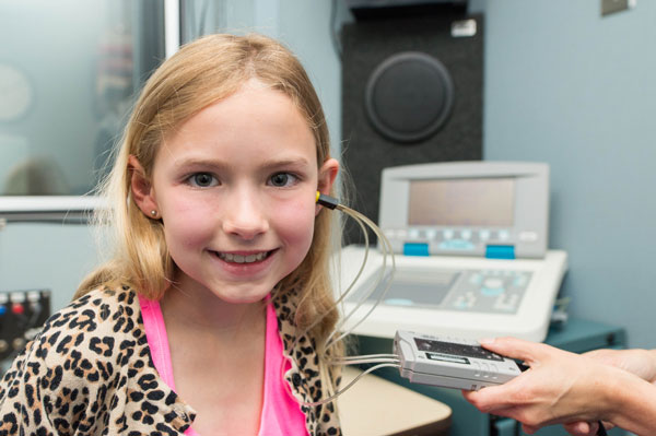 Child using an audio measuring device