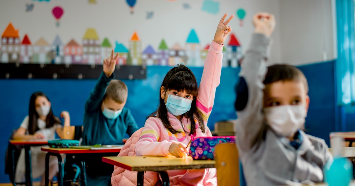 Elementary schoolers wearing masks in class