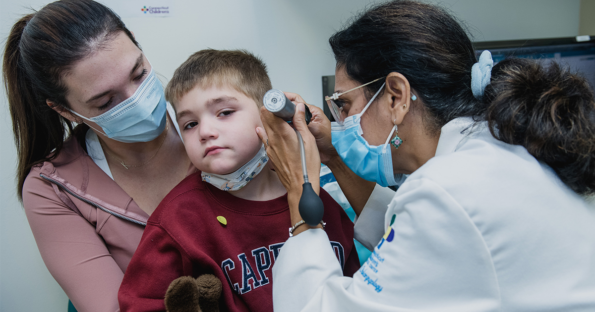 Young boy getting his ears examined