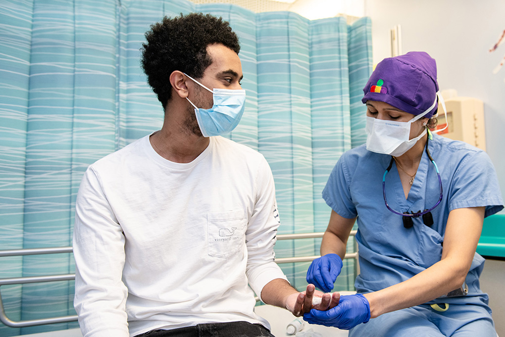 A male teen at the doctor