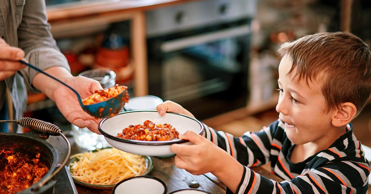 A child accepting a bowl of food