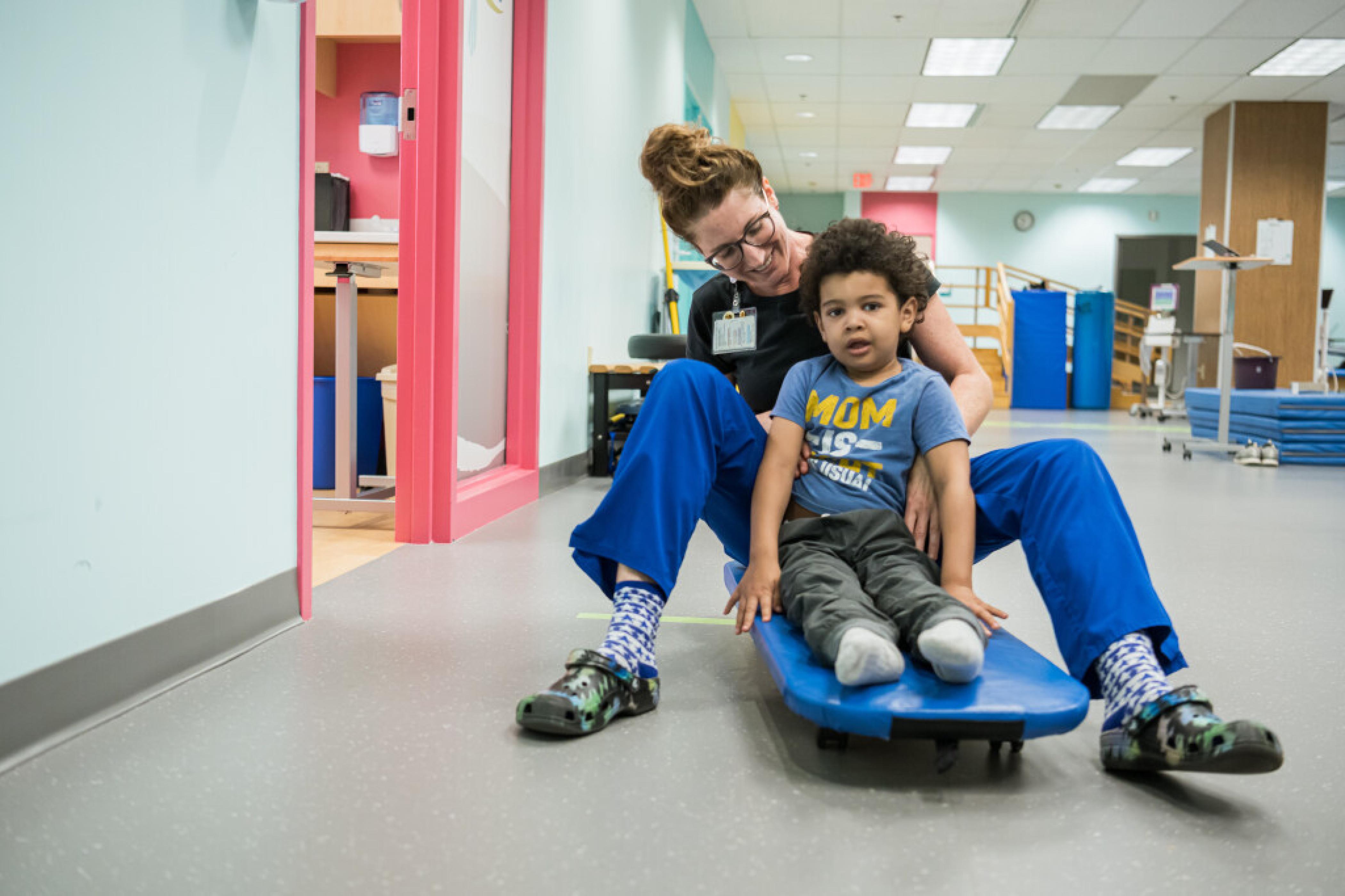 Physical therapist and patient on scooter