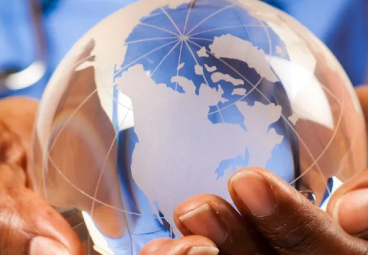 Hands holding a globe