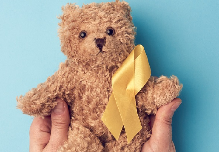 Teddy bear with a yellow ribbon