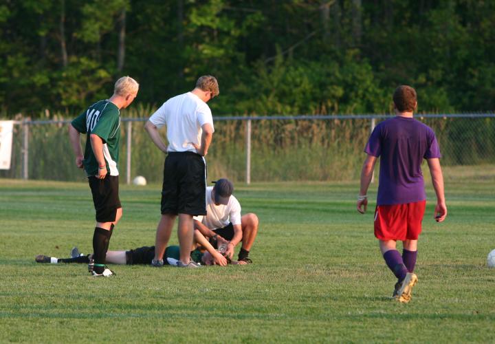 Soccer player down on field with injury