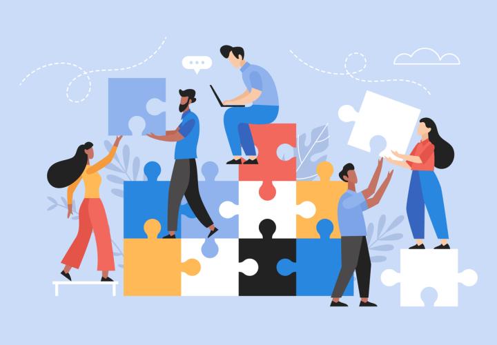 Vector art of people building a puzzle together.