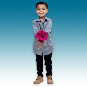 A young boy holding flowers