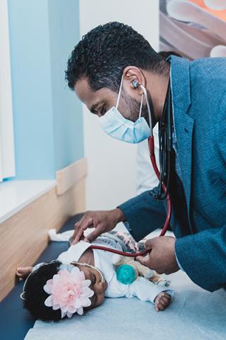 A doctor examining Kiki at Connecticut Children's