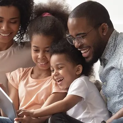 Family looking at a tablet