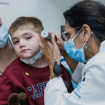 Young boy getting his ears examined