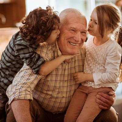 Two young children with their grandpa