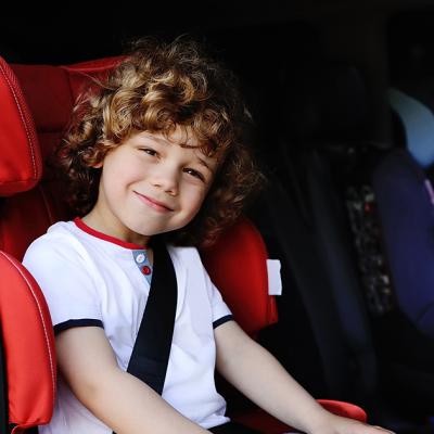 Young boy in his car seat