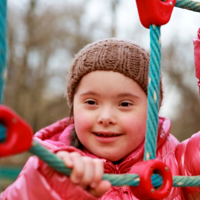 child on ropes in playground