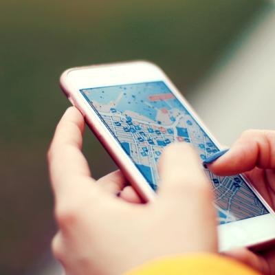 Person looking at a map on an iPhone. 