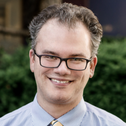 Headshot of Gregory L. Wrubel, MD, a neuroradiologist 